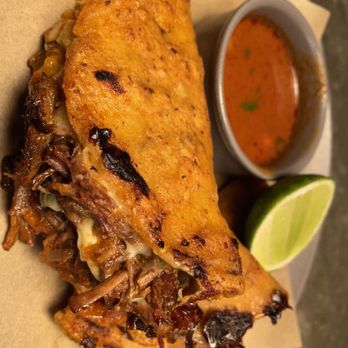 Amano signature dishes Mole Madre, Tacos de Birria, Cochinita Pibil, Hand-cut Carnitas